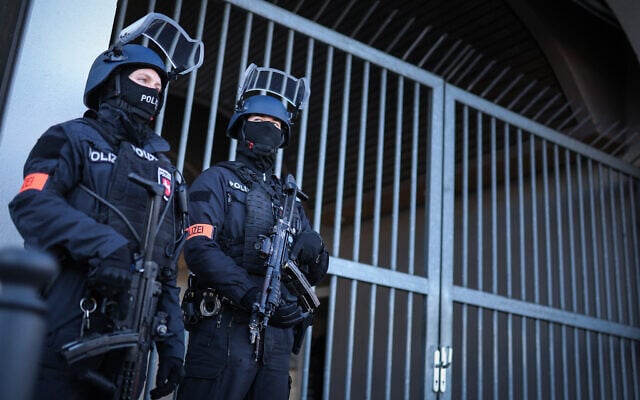 Illustrative: Armed police stand guard on April 1, 2025 at the compound of the court building in Celle, northern Germany. (RONNY HARTMANN / POOL / AFP) Illustrative: Armed police stand guard on April 1, 2025 at the compound of the court building in Celle, northern Germany. (RONNY HARTMANN / POOL / AFP)