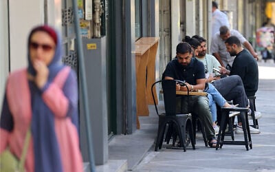 People sit at a cafe in Tehran on September 15, 2025. (Atta Kenare/AFP) People sit at a cafe in Tehran on September 15, 2025. (Atta Kenare/AFP)