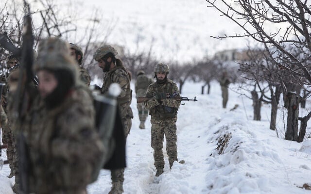 Syrian soldiers stand in the snow in the country's mountainous Qalamoun region, near the border with Lebanon, during a patrol to secure the frontier and prevent smuggling operations on January 1, 2026. (Bakr ALkasem / AFP) Syrian soldiers stand in the snow in the country's mountainous Qalamoun region, near the border with Lebanon, during a patrol to secure the frontier and prevent smuggling operations on January 1, 2026. (Bakr ALkasem / AFP)