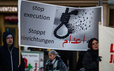Protesters display a banner calling for a halt to executions in Iran during a rally in Berlin, Germany, on January 10, 2026, in support of the Iran protests. (John MacDougall / AFP) Protesters display a banner calling for a halt to executions in Iran during a rally in Berlin, Germany, on January 10, 2026, in support of the Iran protests. (John MacDougall / AFP)