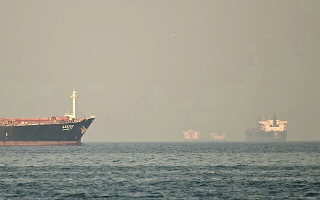 Cargo ships and tankers are seen off coast city of Fujairah, in the Strait of Hormuz in the northern Emirate on February 25, 2026. (Giuseppe CACACE / AFP)