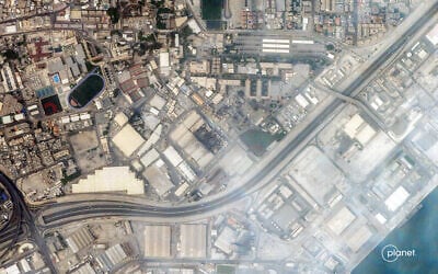 This handout satellite image taken by 2026 Planet Labs PBC on March 1, 2026 shows a view of smoke rising from damage at the US Fifth fleet naval base in Bahrain's capital Manama after it was hit by Iranian strikes. (© 2026 Planet Labs PBC / AFP)