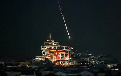 Illustrative: An intercepted projectile falls into the sea near Dubai's Palm Jumeirah archipelago on March 1, 2026. (FADEL SENNA / AFP)