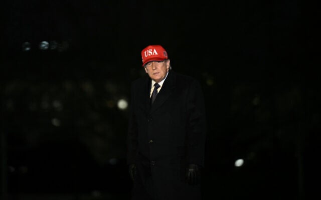 US President Donald Trump exits Marine One on the South Lawn upon returning to the White House in Washington, DC, on March 1, 2026. (Brendan Smialowski/AFP)