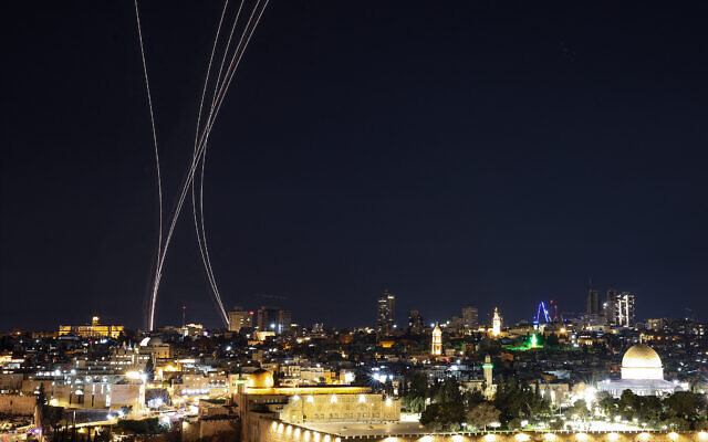 Trails from interceptor missiles are pictured over Jerusalem on March 1, 2026. (HAZEM BADER / AFP)