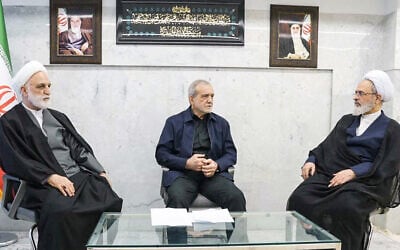 The second meeting of the Interim Leadership Council attended by President Masoud Pezhakian (C) Judiciary Chief Gholamhossein Mohseni Ejei (L) and Alireza Aarafi (R), a member of the Guardian Council's jurist, in Tehran, in a photo made available on March 2, 2026. (Handout / IRIBNEWS / AFP)