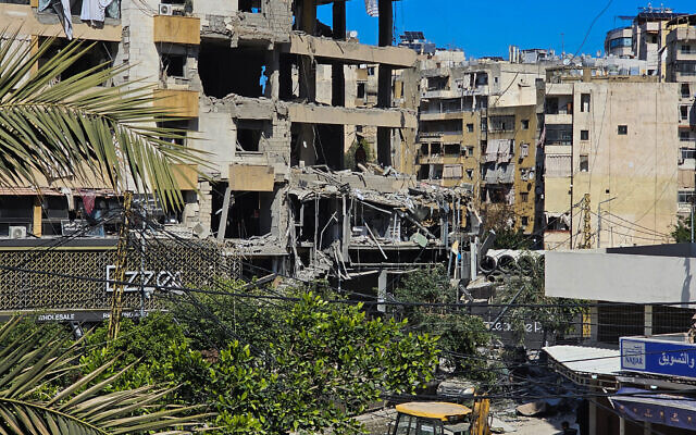 A man  inspects a building damaged in an Israeli airstrike in the southern suburb of Haret Hreik of Beirut the on March 2, 2026. I (Photo by AFP)