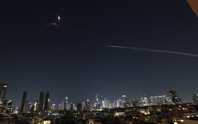Rocket trails are seen in the sky amid a fresh barrage of Iranian missile attacks above the Israeli coastal city of Tel Aviv on March 3, 2026. (Photo by Jack GUEZ / AFP) Rocket trails are seen in the sky amid a fresh barrage of Iranian missile attacks above the Israeli coastal city of Tel Aviv on March 3, 2026. (Photo by Jack GUEZ / AFP)