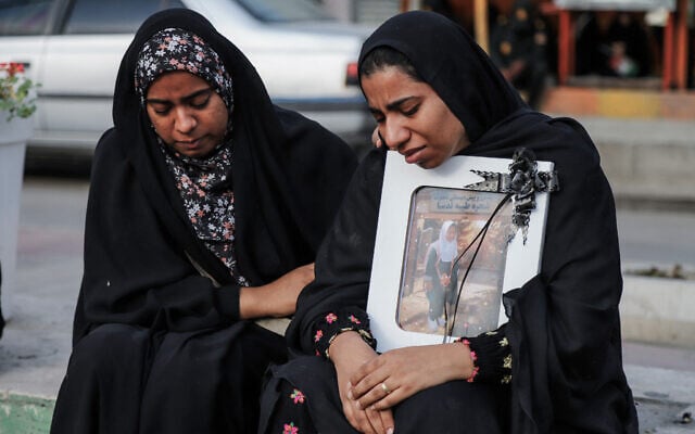 In this picture obtained from Iran's ISNA news agency, mourners attend the funeral of children killed in a reported strike on a primary school in Irans Hormozgan province, in Minab on March 3, 2026. (Amirhossein Khorgooei/ISNA/AFP)