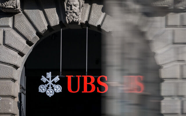 This photograph shows a sign of Swiss giant banking UBS at a branch in Zurich on March 4, 2026. (Fabrice COFFRINI / AFP) This photograph shows a sign of Swiss giant banking UBS at a branch in Zurich on March 4, 2026. (Fabrice COFFRINI / AFP)