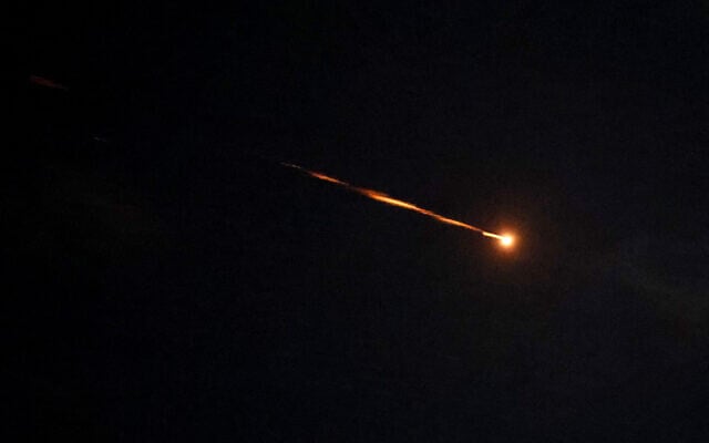 Rocket trails are seen in the sky above the coastal city of Netanya amid a barrage of Iranian missile attacks on March 5, 2026. (JACK GUEZ / AFP)