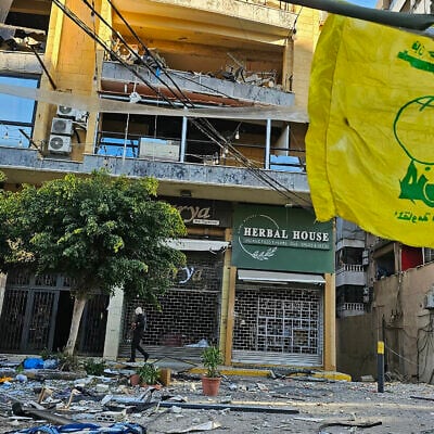 A flag of Hezbollah flutters at the site of destroyed buildings following airstrikes in Beirut's southern suburbs of Ghobeiry neighborhood, on March 5, 2026. (Photo by AFP) A flag of Hezbollah flutters at the site of destroyed buildings following airstrikes in Beirut's southern suburbs of Ghobeiry neighborhood, on March 5, 2026. (Photo by AFP)