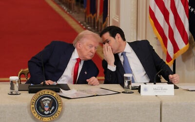 US President Donald Trump (left) speaks to US Secretary of State Marco Rubio during a roundtable discussion on college sports in the East Room of the White House on March 06, 2026 in Washington, DC. (Anna Moneymaker / GETTY IMAGES NORTH AMERICA / Getty Images via AFP)