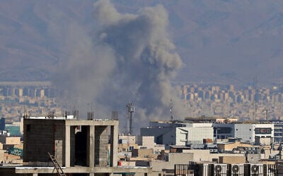 Smoke rises from the site of airstrikes in a central area of the Iranian capital Tehran on March 6, 2026. (ATTA KENARE / AFP)