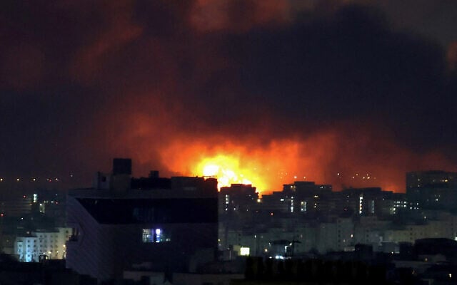 Smoke and fire rise from the site of airstrikes at Mehrabad International Airport in Tehran on March 7, 2026.(ATTA KENARE / AFP)