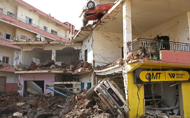 This photograph taken during a media tour organised by the Hezbollah shows destruction at Nabi Chit town after an Israeli military operation in the Bekaa Valley of Lebanon, on March 7, 2026.  (Photo by Nidal SOLH / AFP)