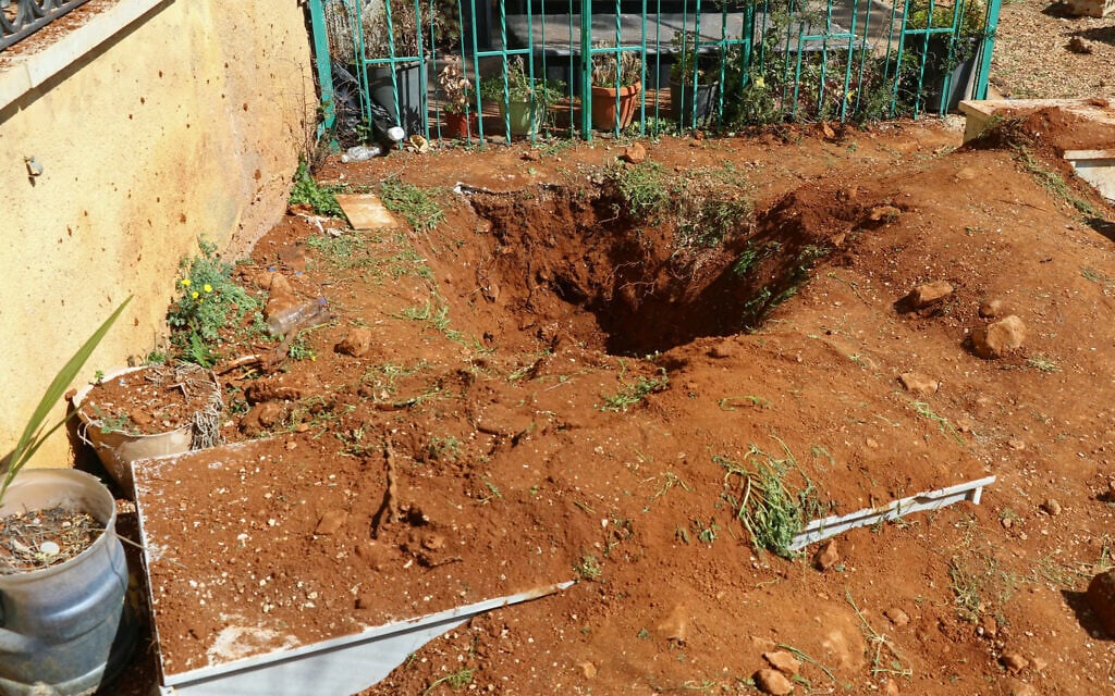 This photograph taken during a media tour organized by the Hezbollah terror group shows a dug-out grave reportedly during an Israeli military operation looking for the remains of Ron Arad at Nabi Chit in the Bekaa Valley of Lebanon, on March 7, 2026 (Nidal SOLH / AFP)