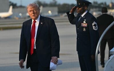 US President Donald Trump disembarks from Air Force One upon arrival at Miami International Airport in Miami, Florida, on March 7, 2026, after traveling to Dover Air Force Base for a dignified transfer solemn event for six US soldiers killed in an Iranian strike in Kuwait. (SAUL LOEB / AFP)