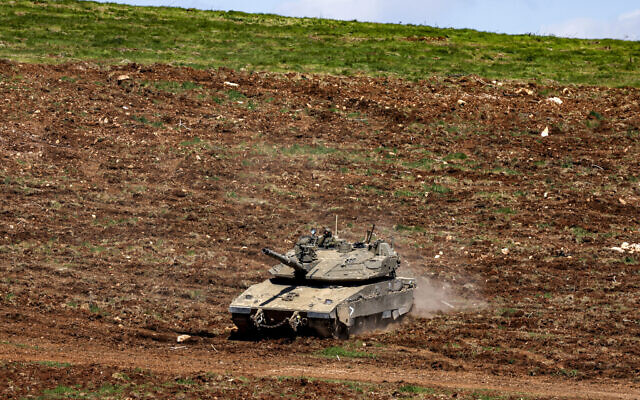 Israeli troops moving into position in the upper Galilee in northern Israel near the Lebanon border on March 9, 2026. (Jalaa MAREY / AFP) Israeli troops moving into position in the upper Galilee in northern Israel near the Lebanon border on March 9, 2026. (Jalaa MAREY / AFP)
