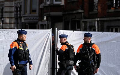 Belgian police man the perimeter around a synagogue on Leon Fredericq street after it was struck overnight by a blast in Liege on March 9, 2026. (JOHN THYS / AFP)