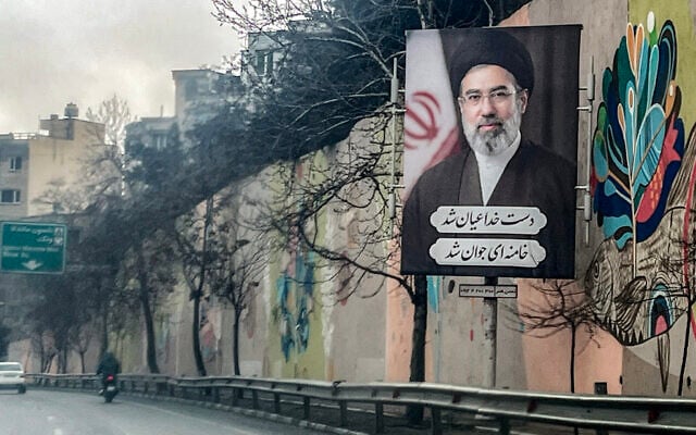 A banner depicting Iran's new Supreme Leader Ayatollah Mojtaba Khamenei is displayed on the side of a highway in Tehran on March 10, 2026. (AFP) A banner depicting Iran's new Supreme Leader Ayatollah Mojtaba Khamenei is displayed on the side of a highway in Tehran on March 10, 2026. (AFP)