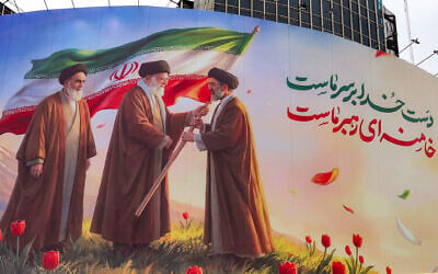 A banner is displayed at Valiasr Square in central Tehran on March 10, 2026, depicting Iran's late supreme leader Ayatollah Ruhollah Khomeini (left) watching as his successor the late Ayatollah Ali Khamenei (center) hands over an Islamic Republic of Iran flag to his son and new supreme leader Mojtaba Khamenei (right). (AFP) A banner is displayed at Valiasr Square in central Tehran on March 10, 2026, depicting Iran's late supreme leader Ayatollah Ruhollah Khomeini (left) watching as his successor the late Ayatollah Ali Khamenei (center) hands over an Islamic Republic of Iran flag to his son and new supreme leader Mojtaba Khamenei (right). (AFP)