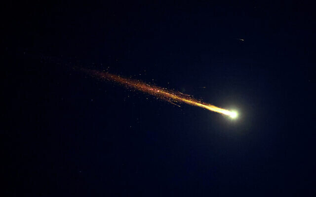 Rocket trails are seen in the sky above Netanya amid a fresh barrage of Iranian missile attacks on March 11, 2026. (JACK GUEZ / AFP) Rocket trails are seen in the sky above Netanya amid a fresh barrage of Iranian missile attacks on March 11, 2026. (JACK GUEZ / AFP)