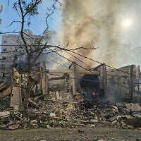 Smoke billows from the site of an Israeli airstrike that targeted the Hadath Lailaky neighborhood in Beirut's southern suburbs on March 11, 2026. (AFP)
