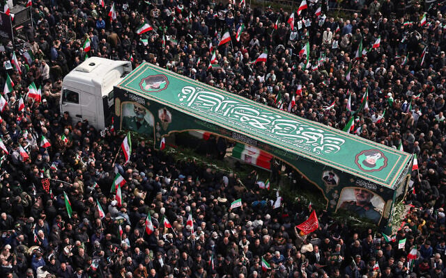 Iranians attend the funerals of Iran's Revolutionary Guards Corps (IRGC) commanders, army commanders and others killed in the early days of the United States and Israeli strikes on Iran, at Enghelab Square in Tehran on March 11, 2026. (Atta KENARE / AFP)