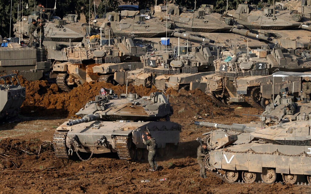 IDF tanks deploy at a position in the Upper Galilee in northern Israel near the border with Lebanon on March 12, 2026. (Jalaa MAREY / AFP) IDF tanks deploy at a position in the Upper Galilee in northern Israel near the border with Lebanon on March 12, 2026. (Jalaa MAREY / AFP)