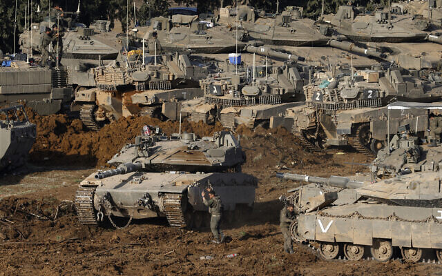IDF tanks deploy at a position in the Upper Galilee in northern Israel near the border with Lebanon on March 12, 2026. (Jalaa MAREY / AFP)