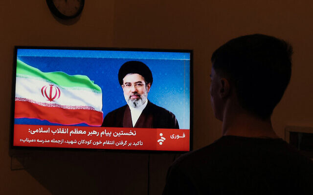 A man watches a televised statement purportedly by Iran's new supreme leader Mojtaba Khamenei on March 12, 2026. (AFP) A man watches a televised statement purportedly by Iran's new supreme leader Mojtaba Khamenei on March 12, 2026. (AFP)