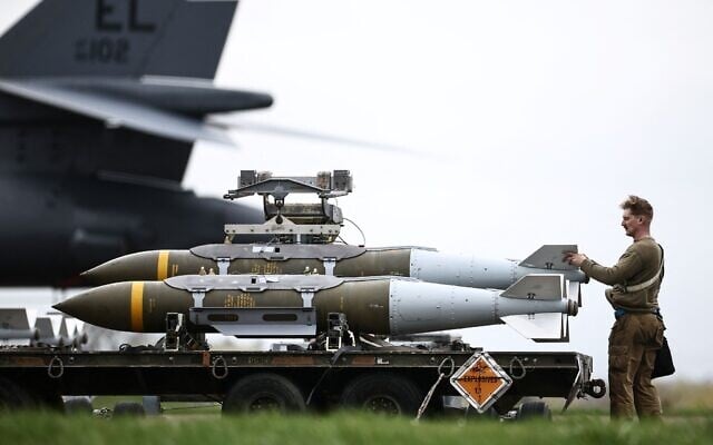 US Air Force military ground personnel prepare Joint Direct Attack Munitions for a B-1 Lancer bomber on the tarmac at RAF Fairford in southwest England on March 12, 2026. (Henry NICHOLLS / AFP) US Air Force military ground personnel prepare Joint Direct Attack Munitions for a B-1 Lancer bomber on the tarmac at RAF Fairford in southwest England on March 12, 2026. (Henry NICHOLLS / AFP)