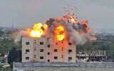 A fireball erupts from the site of an Israeli airstrike that targeted a building in the southern Lebanese village of Abbasiyyeh on March 13, 2026, amid fighting between Israel and Lebanon's Iran-backed Hezbollah terror group. (Kawnat Haju/AFP)