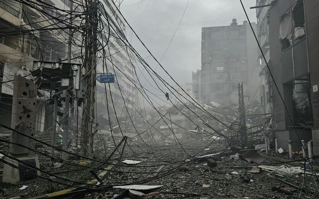 A photograph shows the site of an overnight Israeli airstrike that targeted Beirut's southern suburbs, on March 14, 2026. (AFP) A photograph shows the site of an overnight Israeli airstrike that targeted Beirut's southern suburbs, on March 14, 2026. (AFP)