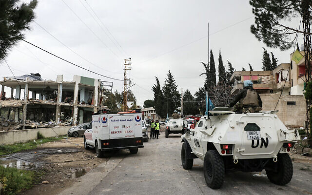 United Nations peacekeepers with the UN Interim Force in Lebanon (UNIFIL) drive past a destroyed healthcare center building in the aftermath of an Israeli strike in the southern Lebanese town of Burj Qalawiya on March 14, 2026. (Kawnat HAJU/ AFP) United Nations peacekeepers with the UN Interim Force in Lebanon (UNIFIL) drive past a destroyed healthcare center building in the aftermath of an Israeli strike in the southern Lebanese town of Burj Qalawiya on March 14, 2026. (Kawnat HAJU/ AFP)