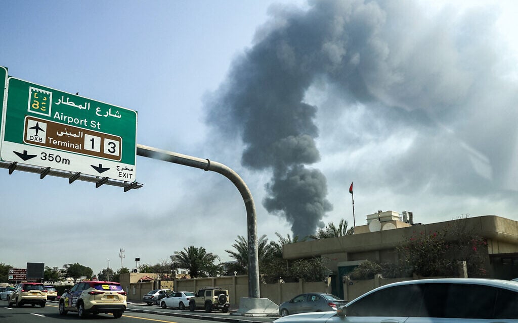 A smoke plume rises from an ongoing fire at Dubai International Airport in Dubai on March 16, 2026, after a "drone-related incident" sparked a fuel tank fire nearby, as Iran kept up its Gulf attacks. (Photo by AFP) A smoke plume rises from an ongoing fire at Dubai International Airport in Dubai on March 16, 2026, after a "drone-related incident" sparked a fuel tank fire nearby, as Iran kept up its Gulf attacks. (Photo by AFP)