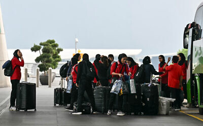Members of Iran's women's football team arrive at the Kuala Lumpur International Airport in Sepang on March 16, 2026 (Photo by MOHD RASFAN / AFP)