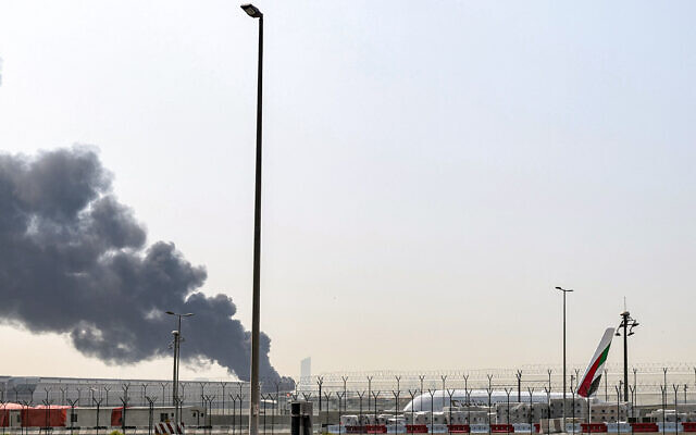 A smoke plume rises from an ongoing fire after an apparent Iranian attack near Dubai International Airport in Dubai on March 16, 2026 (Fadel SENNA / AFP) / A smoke plume rises from an ongoing fire after an apparent Iranian attack near Dubai International Airport in Dubai on March 16, 2026 (Fadel SENNA / AFP) /