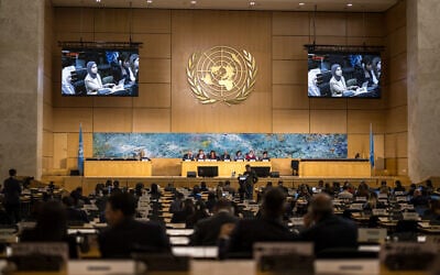 File: A representative of Qatar is seen on screens as he delivers a speech on human rights in the Islamic Republic of Iran during a session of the UN Human Rights Council, in Geneva on March 16, 2026. (Fabrice COFFRINI / AFP)
