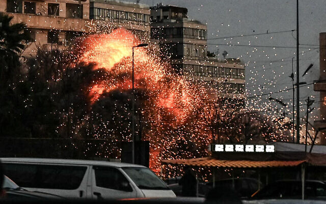 A fireball rises from the site of an Israeli airstrike that targeted a building in Beirut's Bashoura neighborhood on March 18, 2026 (FADEL itani / AFP)