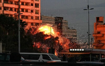 A fireball rises from the site of an Israeli airstrike that targeted a building in central Beirut early on March 18, 2026. (FADEL Itani / AFP)