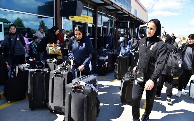 Members of Iran's women's soccer team exit Turkey's Igdir airport, on March 18, 2026. (Ali IHSAN OZTURK / AFP) Members of Iran's women's soccer team exit Turkey's Igdir airport, on March 18, 2026. (Ali IHSAN OZTURK / AFP)