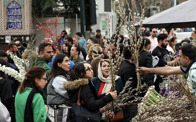 Iranians shop at the Tajrish Bazaar in northern Tehran on March 19, 2026, on the eve of Nowruz, the Persian New Year. (AFP)