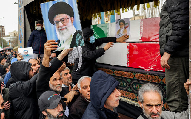 Mourners bid farewell to the bodies of Iran's slain intelligence minister Esmail Khatib and his family during their funeral after the weekly Friday noon prayers in Tehran on March 20, 2026. (Photo by AFP) Mourners bid farewell to the bodies of Iran's slain intelligence minister Esmail Khatib and his family during their funeral after the weekly Friday noon prayers in Tehran on March 20, 2026. (Photo by AFP)