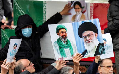Mourners bid farewell to the bodies of Iran's slain intelligence minister Esmaeil Khatib and his family during their funeral, after the weekly Friday noon prayers in Tehran, on March 20, 2026. (AFP)