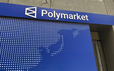 The logo of the prediction market online platform Polymarket is seen outside their new location called "The Situation Room" during its opening day in Washington, DC, on March 20, 2026.  (Théo Marie--Courtois / AFP)