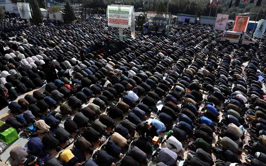 Iranian Shias take part in Eid al-Fitr prayers, marking the end of the Muslim holy month of Ramadan, at the Grand Mosalla mosque in Tehran, March 21, 2026. (AFP)