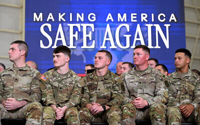 Members of the US Army National Guard listen as US President Donald Trump speaks during a Memphis Safe Task Force roundtable on March 23, 2026 in Memphis, Tennessee. (ROBERTO SCHMIDT / GETTY IMAGES NORTH AMERICA / Getty Images via AFP)