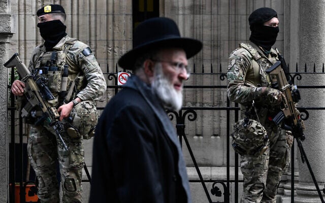 Belgian military personnel stand guard outside a synagogue in central Antwerp as part of Belgium's reinforced security measures established at Jewish schools and synagogues, March 23, 2026. (John Thys/AFP) Belgian military personnel stand guard outside a synagogue in central Antwerp as part of Belgium's reinforced security measures established at Jewish schools and synagogues, March 23, 2026. (John Thys/AFP)